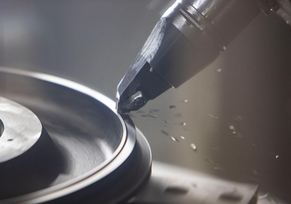 Close-up of a turning tool cutting a bore